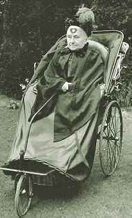 The elderly Keleg in a wicker wheelchair